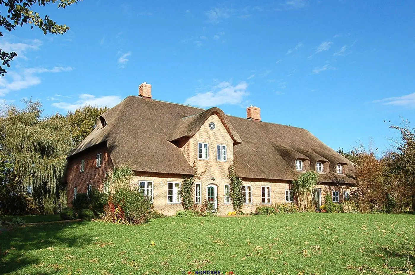 Reetdachhaus mit Ferienwohnungen am Alten Gardinger Deich